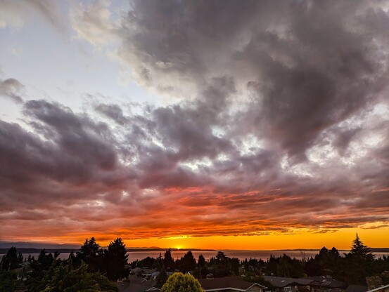 Sunset over Puget Sound with high clouds.