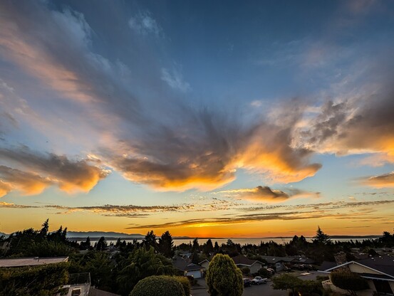 Sunset over Puget Sound with high clouds.