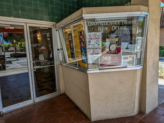 The Oroville State Theater -box office. 

https://www.orovillestatetheatre.com/

Built between 1927 and 1928, the State Theatre was designed by San Francisco architect Timothy Pflueger and opened its doors on April 7, 1928. It was one of several movie palaces owned and operated by the T&D chain throughout California, a number of which Pflueger designed for the company. The State Theatre was Oroville’s first Spanish Colonial Revival style building, one of only two high examples of the style in the city.

This style of architecture is growing increasingly rare in California. It was originally popular in California and Florida, but with a massive influx of population and the resulting implications to development, many of the original buildings in California were torn down to make way for new construction. Most of the remaining examples are tucked away in smaller communities where development has occurred at a slower rate and older buildings were left mostly intact. The Oroville State Theatre is one such example, but it is also an example of how limited small town resources make restoration and preservation difficult. It is vital that these communities make every effort to save, salvage, and protect these remaining structures.

