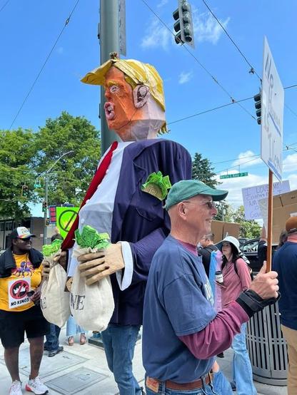 Giant Trumpet Moneybags paper mache puppet.  
